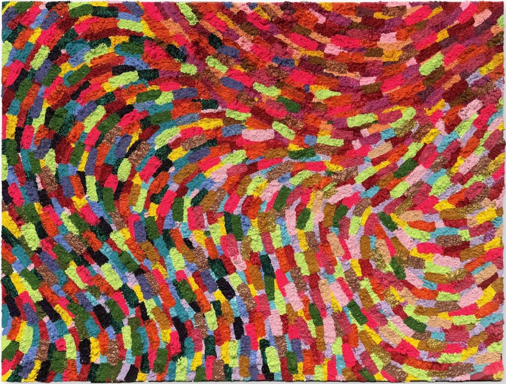 This vibrant artwork is a dynamic explosion of color, capturing the viewer with its swirling motion and rhythmic energy. The painting is composed of countless, small brushstrokes meticulously layered to create an intricate pattern of movement across the canvas. Bold reds, blues, yellows, and greens interplay harmoniously, forming a tapestry of hues that seem to pulse and sway. The swirling design evokes a sense of fluidity and transformation, as if the colors are in constant motion. This optical dynamism invites viewers to journey through its undulating patterns, discovering new combinations and contrasts at every turn. The artwork's ability to engage and mesmerize lies in its masterful use of color and form, making it a captivating centerpiece that speaks to the transformative power of art.